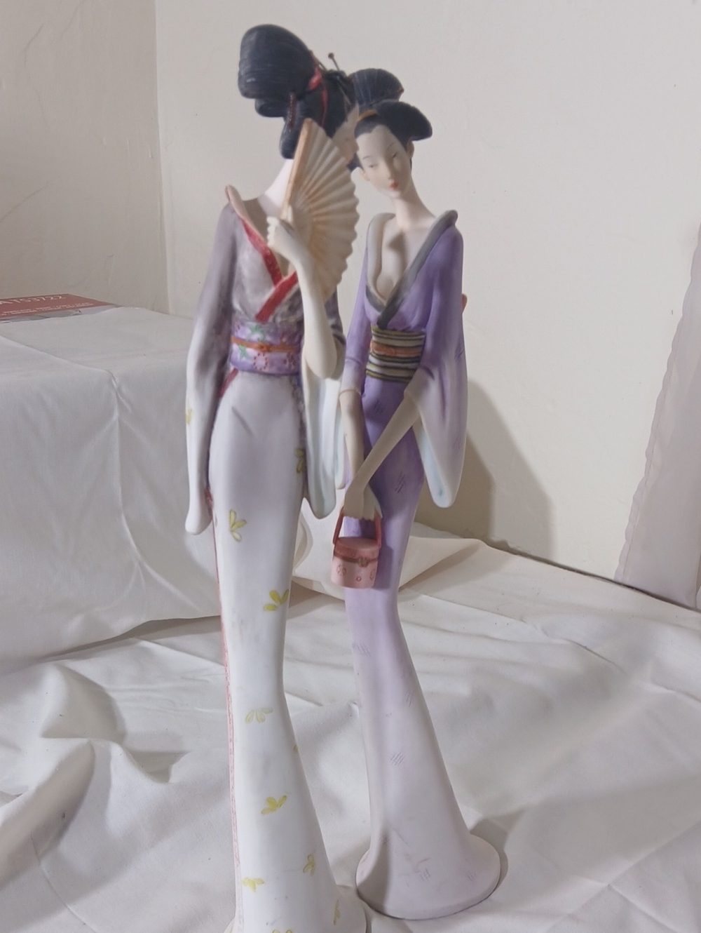 Elegant Porcelain Geisha Figurines in White and Lavender